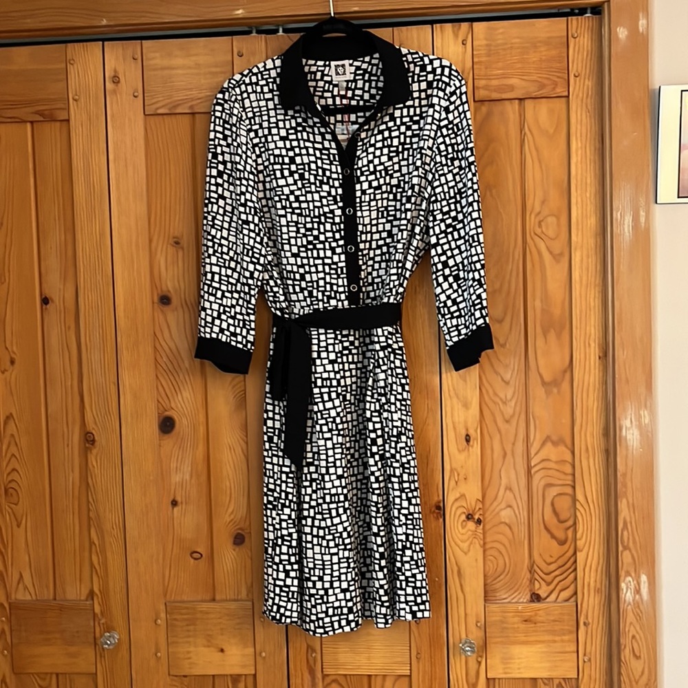 New with tags—beautiful belted black and white dress.  Side zipper.